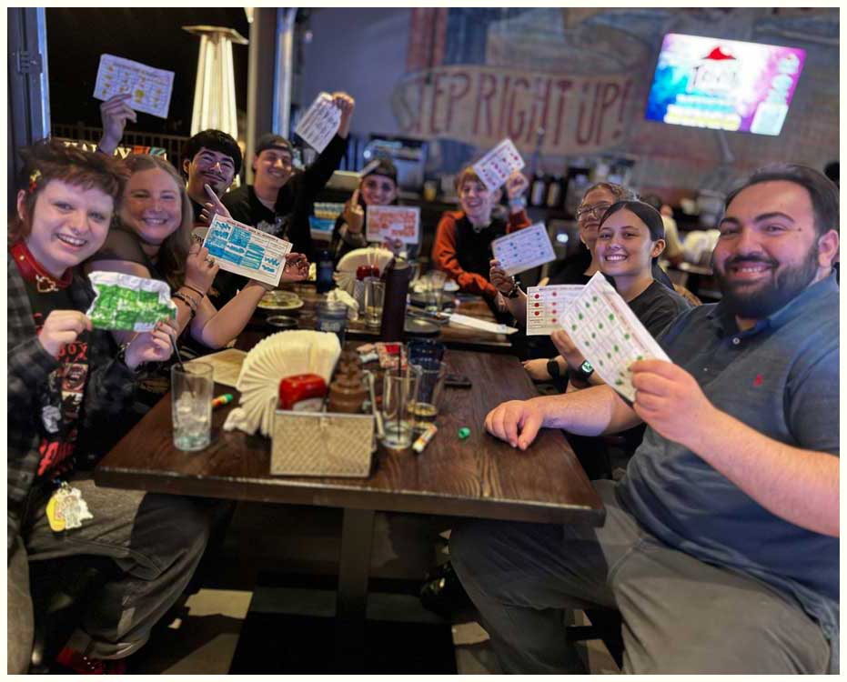 crowd playing music bingo brunch at barton orchards hosted by JB from hudson valley trivia co Smiling Friends having fun playing Music Bingo at Sideshow Kitchen and Bar in New Paltz NY hosted by Hudson Valley Trivia Co